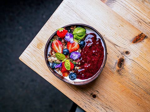 Granola with berry compote, yoghurt and fresh berries at Ten Streets Social