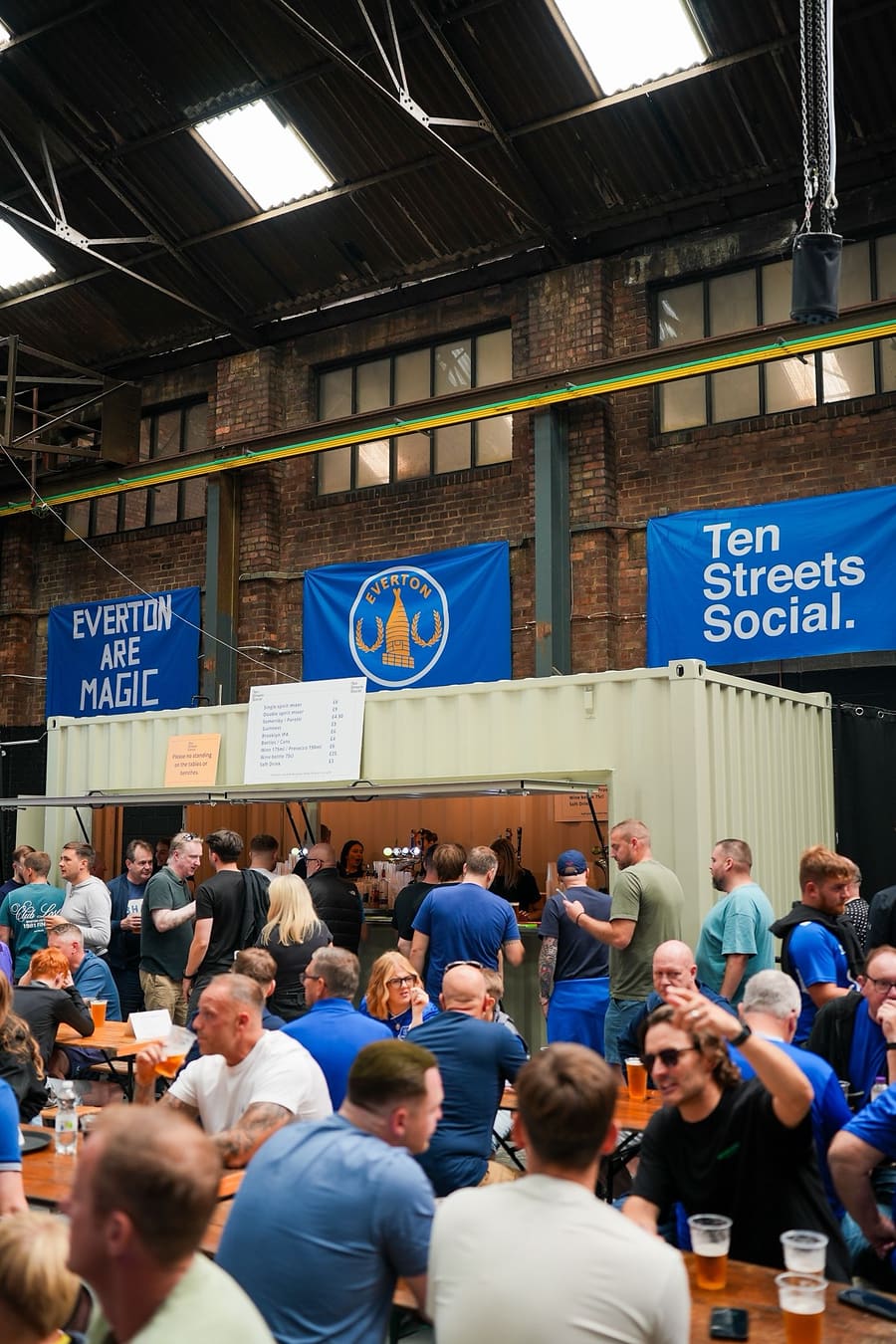 The Ten Streets Social fan zone packed with Everton supporters under the banners