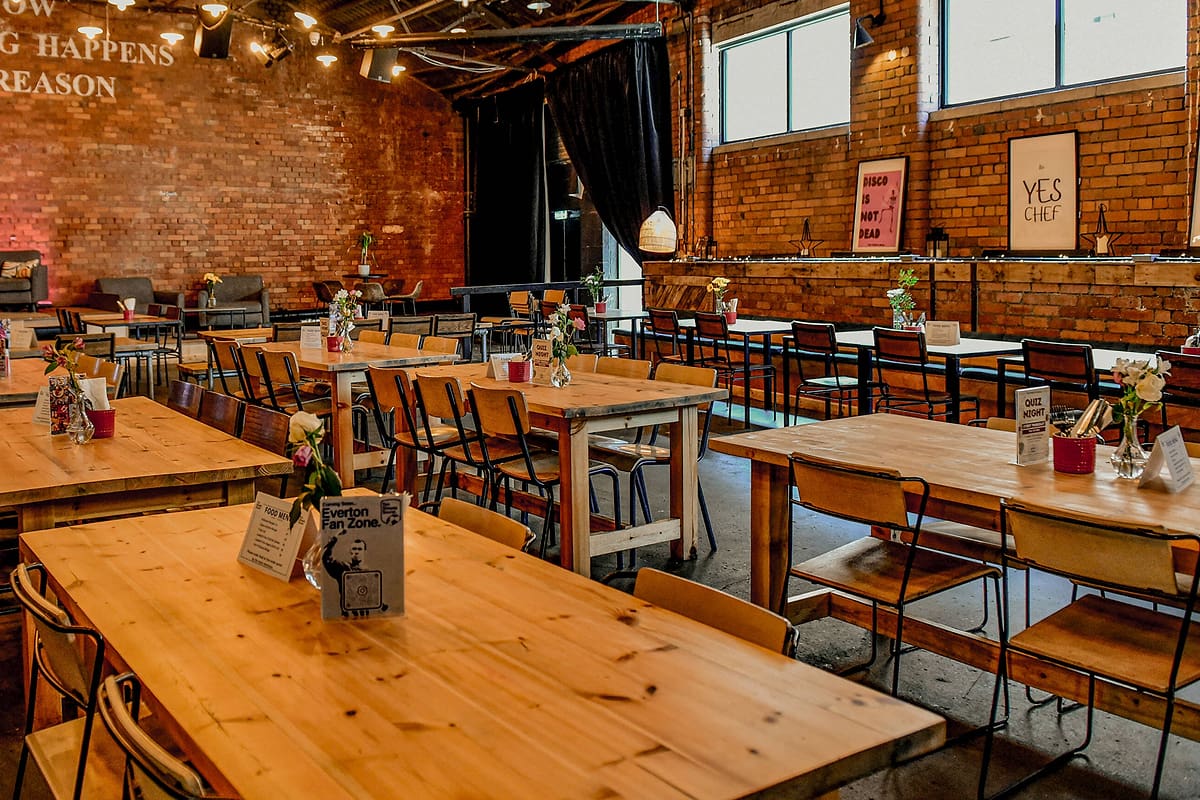 Daylight across the timber tables in the Ten Streets Social warehouse